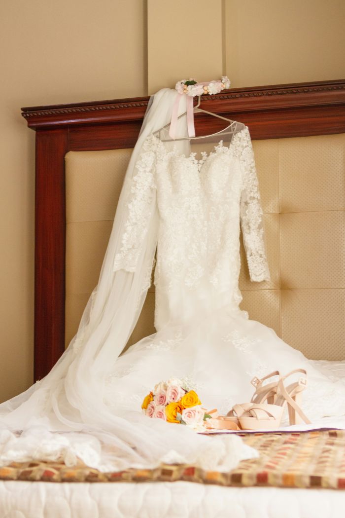 Bride reflecting in mirror with jewelry